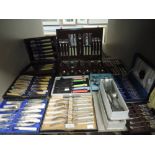 A large lot of mixed vintage and antique boxed cutlery sets and canteen including cake forks, fish