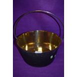 A well polished brass cast jam pan