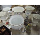 A selection of Wedgwood rose vases, two planters , two candlesticks and more.