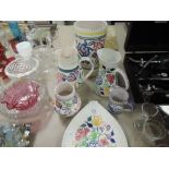 Six items of Poole pottery including vases,jugs and plate.