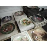 A large lot of collectable display plates with boxes.
