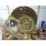 A selection of brass wares including several nautical galleon themed wall plaques and mirror