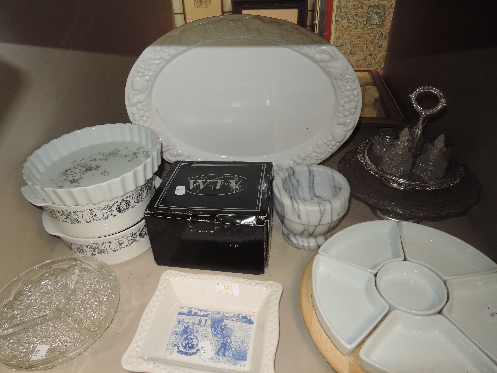 A mixed lot of items including serving dishes, flan dish, platter and a box of mugs and more.