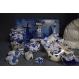A selection of blue and white wear ceramics in Dutch delft designs including tiles