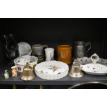 A selection of ceramics including Royal Worcester Evesham and two cast bells