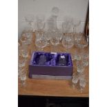 A selection of clear cut and crystal glass ware including brandy wine and whisky glasses