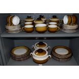 A large part dinner and tea service by Denby in a brown and cream colour way