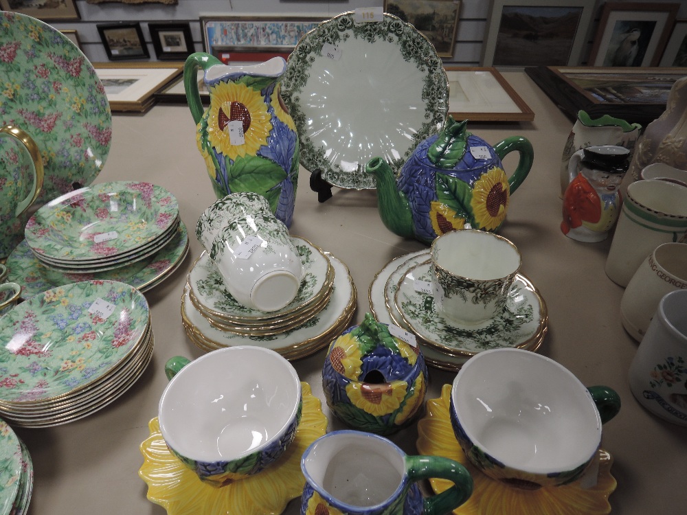 A part breakfast set having moulded sunflower design if blue ground including cups and saucers,