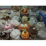 A collection of vintage and retro teapots including novelty examples.