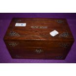 An antique tea caddy having mother of pearl and metal inlay and banding with good inner