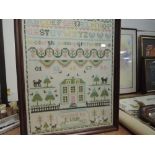 An embroidery sampler by E Wier dated 1992 depicting house,alphabet and trees.