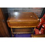 A mid 20th Century oak Priory style tea trolley