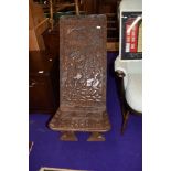 A tribal art carved ethnic palaver chair