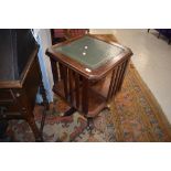 A reproduction Regency style revolving bookcase, width approx. 50cm, having brass claw feet