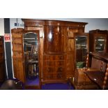 An early 20th Century mahogany and inlaid wardrobe/press of large proportions, labelled Maple and