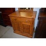 A pine cabinet, suitable for a variety of uses, with computer or entertainment style top drawer,