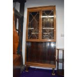 An early 20th Century stripped mahogany bookcase with open shelves under