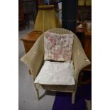 A Lloyd Loom tub chair