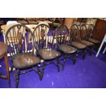 A set of six vintage wheelback dining chairs