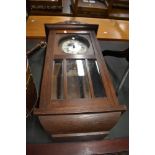 An early 20th Century oak wall clock case, with later quartz movement