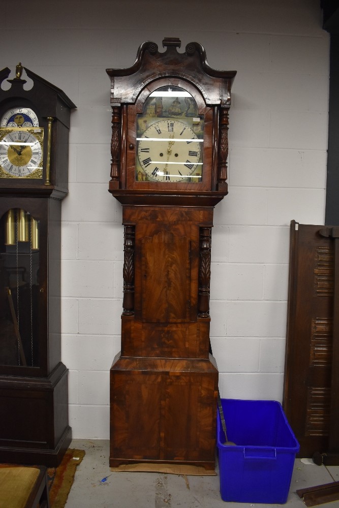 A late 19th Century flame mahogany longcase clock having painted arch dial, 8 day movement,