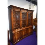 A reproduction concave bookcase by Bevan Funnel , width approx.178cm