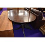 A Regency style extending dining table, nice quality on brass claw feet and casters, one