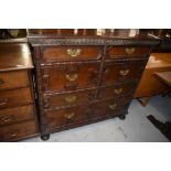 A 19th Century Jacobean style cushion chest of seven drawers, in side by side configuration over