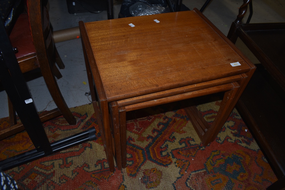 A vintage teak G plan nest of three table