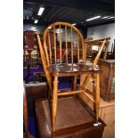 A stained frame hoop and stick back carver chair