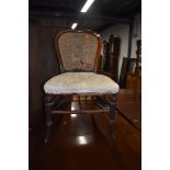 A Victorian mahogany dining chair having stuffed seat and bergere back (needs attention)