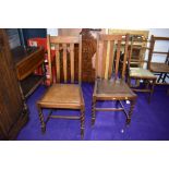 A pair of mid 20th Century oak dining chairs