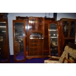 An early 20th Century mahogany and inlaid wardrobe/press of large proportions, labelled Maple and