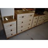A selection of laminate pine effect bedroom furniture comprising two sets of drawers and a pair of