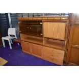 A vintage teak effect laminate wall unit, dimensions approx. W150cm H130cm