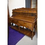 A reproduction oak low dresser, Titchmarsh and Goodwin or similar quality, width approx. 142cm