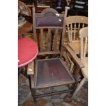 An early 20th Century oak Arts and Crafts style carver chair