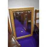 A reproduction gilt frame wall mirror, approx. 64 x 95cm
