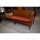 A golden oak pew/form having 6 panel back, width approx. 210cm