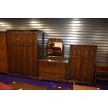 An early to mid 20th Century dark oak , Priory style three piece bedroom suite comprising double