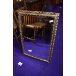 A reproduction gilt frame wall mirror, approx. 52 x 77cm