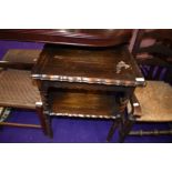 An early 20th Century dark stained oak fold over occasional card table