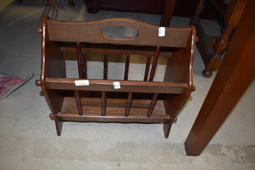 A tradtional spindle style magazine rack