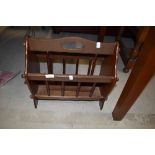 A tradtional spindle style magazine rack