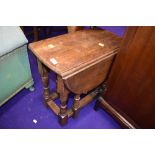A small oak occasional drop leaf table