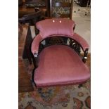 A late 19th/early 20th Century tup chair having later pink dralon upholstery