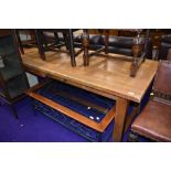 A good quality light stain refectory kitchen dining table with frieze drawers