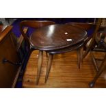 A two table dark stained nest by Ercol, width of largest table, width approx. 49cm