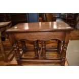 A traditional oak nest of one large over two small tables, large approx. 62 x 37cm