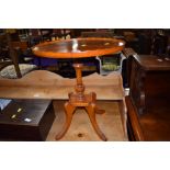 A reproduction yew wood occasional/wine table